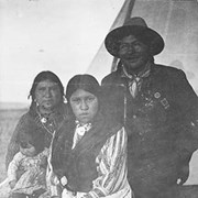 Cover image of Flora (Crawler) McLean with baby, Elizabeth (McLean) Bearspaw, George McLean (Tatâga Mânî) (Walking Buffalo)